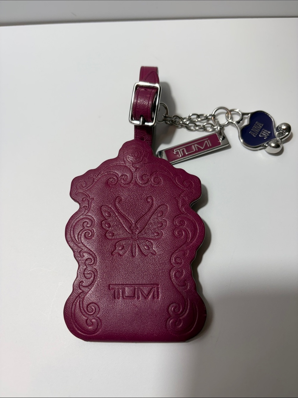 Tumi Plum Leather Butterfly Luggage Tag